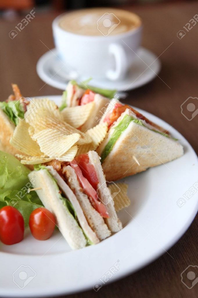 images1399096 10941945 Club sandwich with coffee on wood background Stock Photo